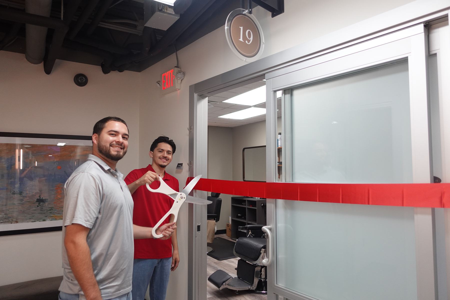 Josh and Edgar cutting the ribbon at the grand opening of Refined Barbers in The Heights, Houston